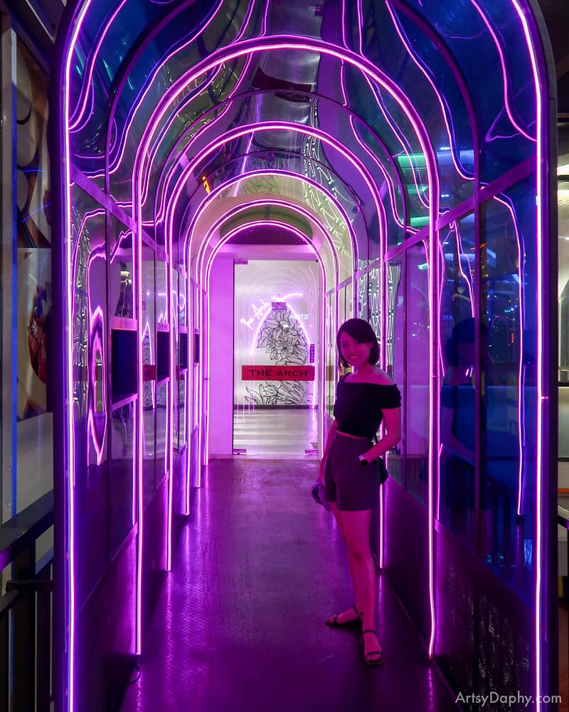 beautiful neon and acrylic hallway towards a thai restaurant